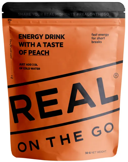 Real On the Go Energidrikk Peach Tilsett vann, rist og drikk fra posen 